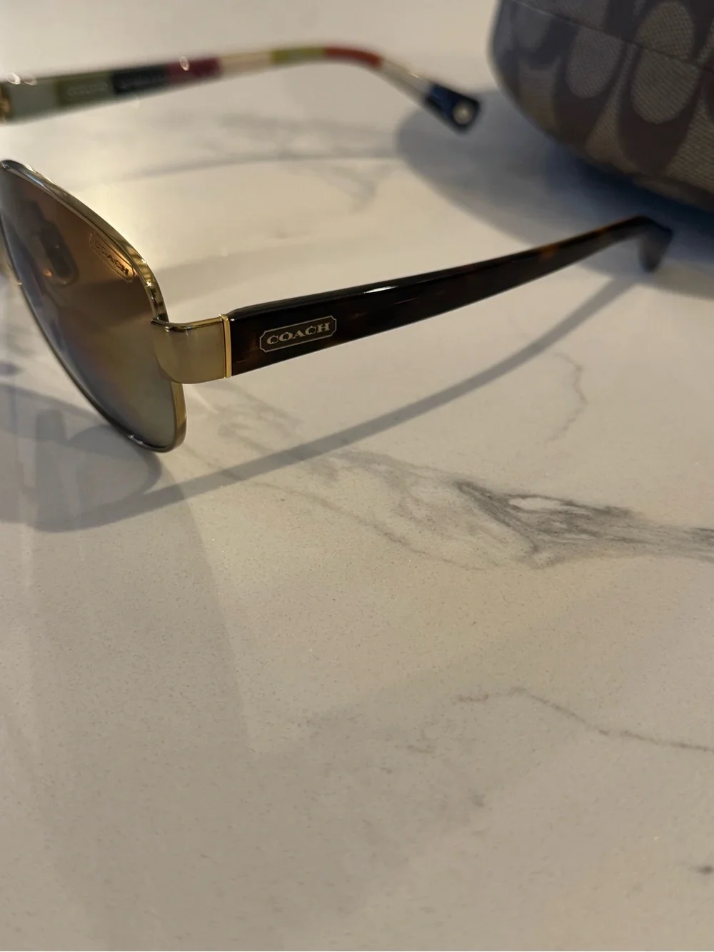 Coach Kristina HC7003 Aviator Gold Frame Sunglasses with Brown Gradient Lenses